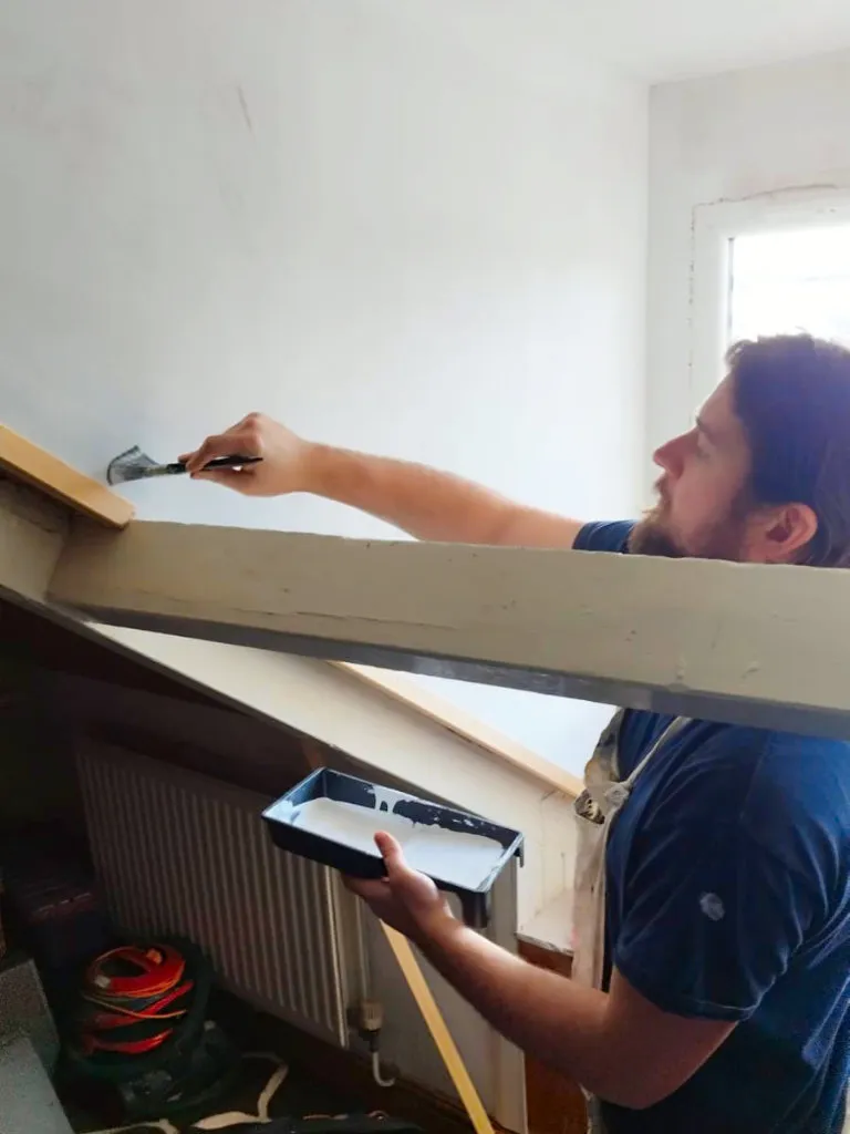 /painter Decorating An Angled Wall